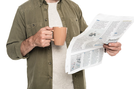 partial view of man with cup of coffee and newspaper isolated on whiteの写真素材