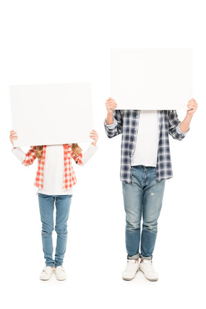 obscured view of father and daughter with blank banners isolated on whiteの写真素材