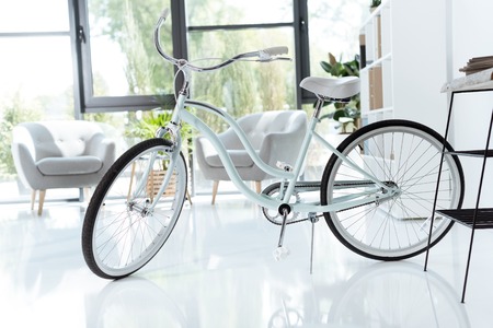 interior of empty creative office with bicycle and white chairsの写真素材