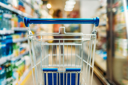 close up view of empty shopping cart in supermarketの写真素材