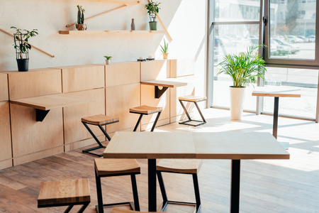stylish interior of modern cafe with stylish wooden furnitureの写真素材