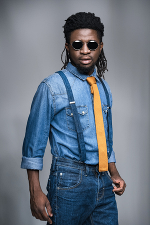 stylish african american man in black sunglasses isolated on grayの写真素材