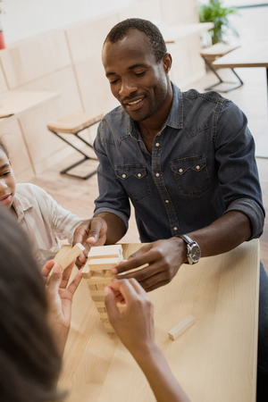 happy african-american family playing tower gameの写真素材