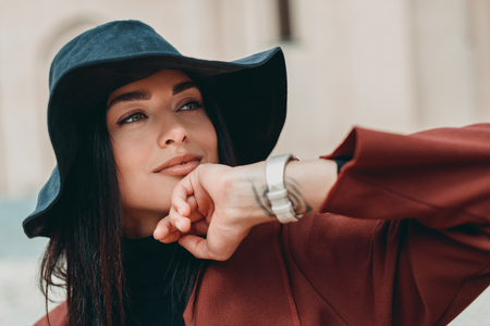 young smiling woman in hat looking awayの写真素材
