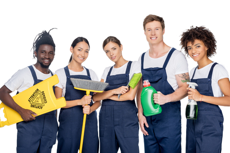 group of young multiethnic cleaners with various cleaning supplies isolated on whiteの写真素材