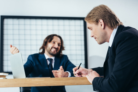 professional middle aged businessmen working in office