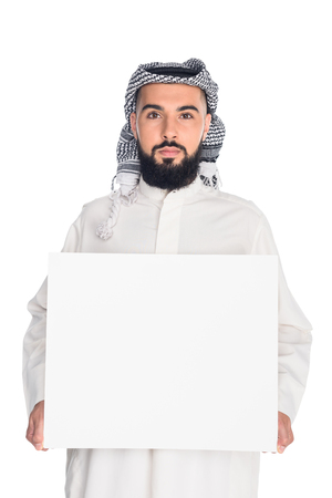 young muslim man holding blank board isolated on whiteの写真素材