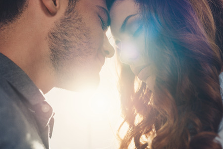 close up view of sensual couple in love standing head to headの写真素材