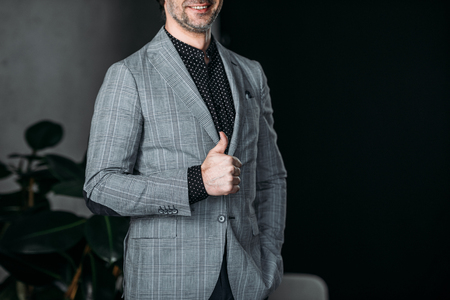 cropped shot of smiling businessman showing thumb upの写真素材