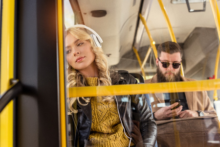 portrait of young people riding in public transportの写真素材