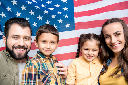 happy family with children holding american flagの写真素材