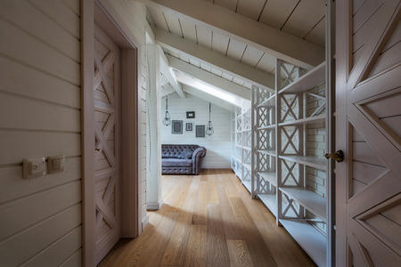 hallway with wooden doors and walls in modern country houseの写真素材