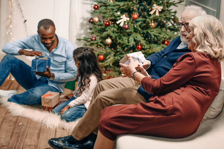 multiethnic family spending time together on christmasの写真素材