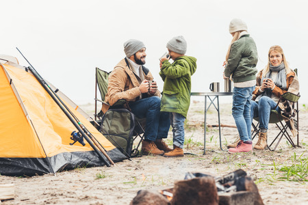 family on camping drinking teaの写真素材