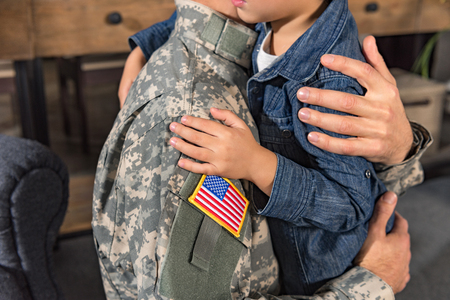 cropped shot of embracing military father and sonの写真素材