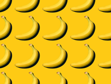 top view of fresh ripe bananas pattern on yellow