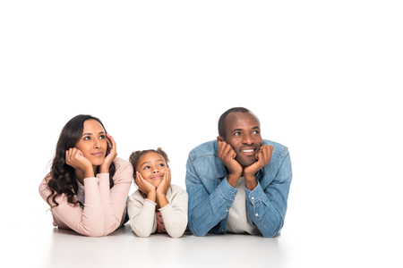 pensive african american family leaning on hands and looking away isolated on whiteの写真素材