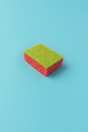 studio shot of washing kitchen sponge on blueの写真素材