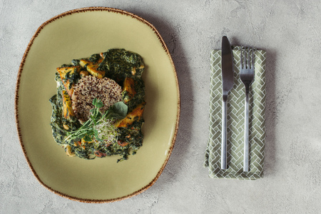 top view of panikesh with cashew nuts and spinach on grey tabletopの写真素材
