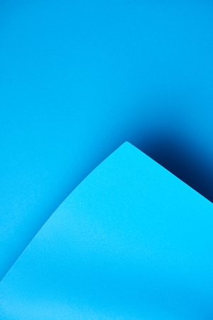 close-up view of beautiful bright blue abstract paper backgroundの写真素材