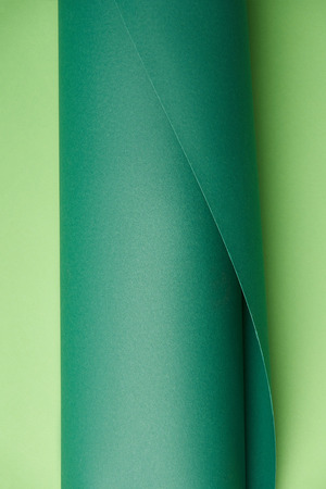 close-up view of dark and light green abstract paper backgroundの写真素材