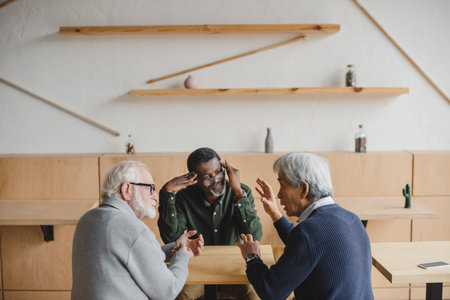 group of multiethnic senior friends having discussの写真素材