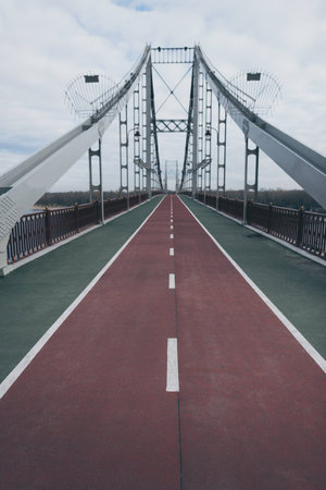 empty pedestrian bridge on cloudy autumn dayの写真素材
