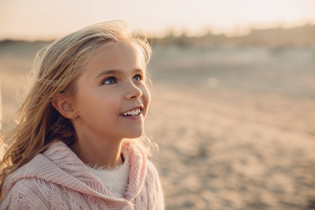 portrait of adorable happy child on sandy beach