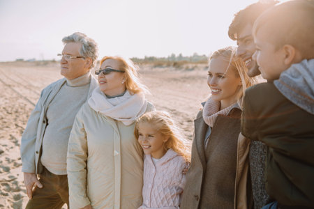 multigenerational family walking together at seaside