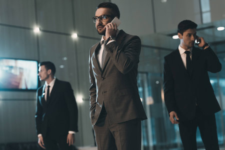 businessman talking by smartphone in business centerの写真素材
