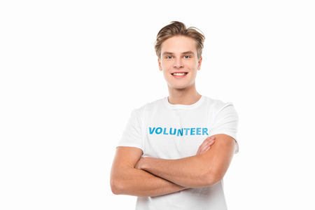 young volunteer with crossed arms isolated on whiteの写真素材