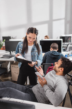 colleagues working together at modern office