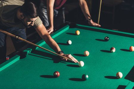 handsome caucasian man playing in pool