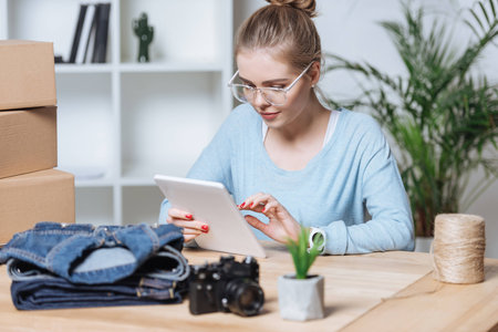 portrait of entrepreneur using digital tablet at home officeの写真素材