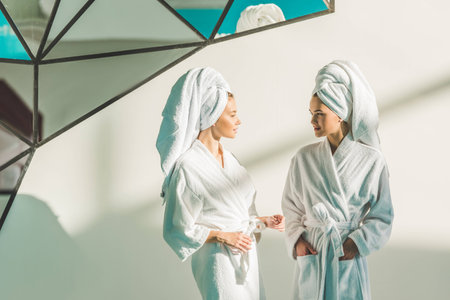beautiful young women in bathrobes at spa centerの写真素材