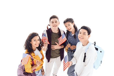 multiethnic teen students holding usa flags isolated on whiteの写真素材