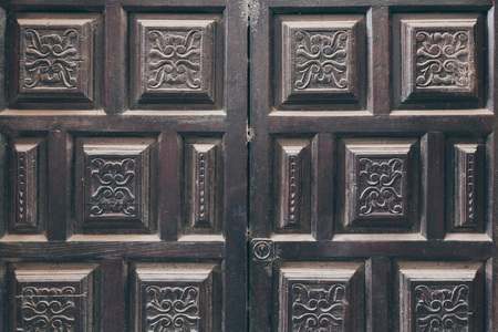 black doors decorated with arabesque pattern for backgroundの写真素材