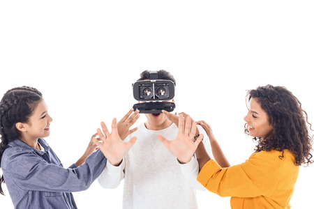 teenage students having fun with vr headset isolated on whiteの写真素材