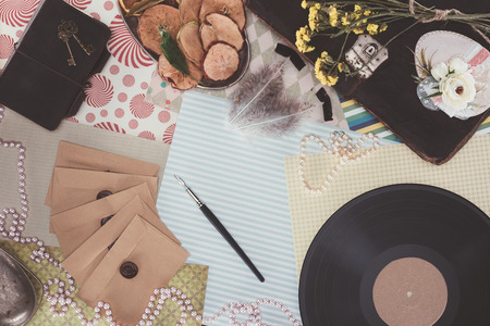 top view of retro objects over pack paper backgroundの写真素材
