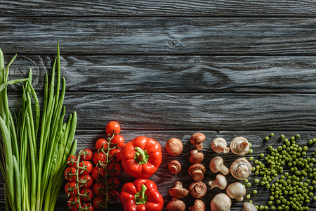 top view of various raw vegetables on wooden tabletop