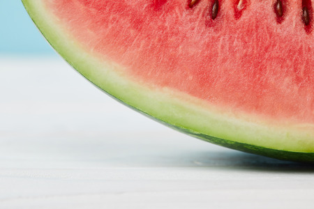 close up view of fresh watermelon slice on white surfaceの写真素材
