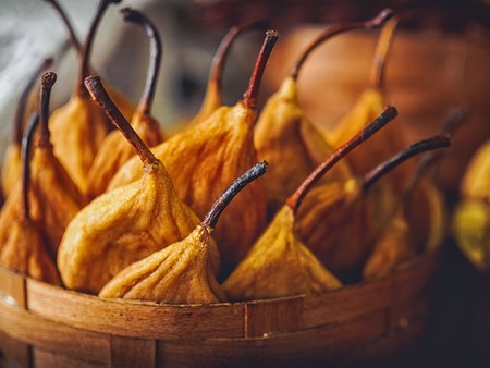 close-up shot of delicious dried pears in basketの写真素材