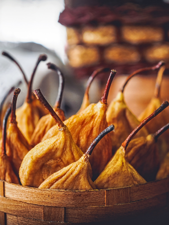 close-up shot of tasty dried pears in basketの写真素材