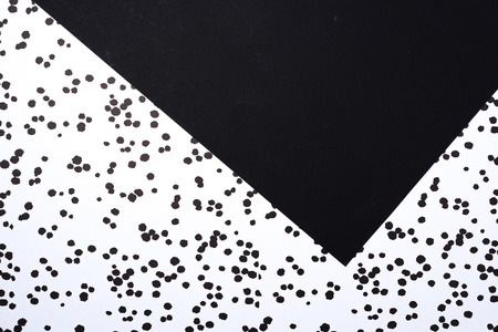 top view of black and white abstract composition with ink blots for background