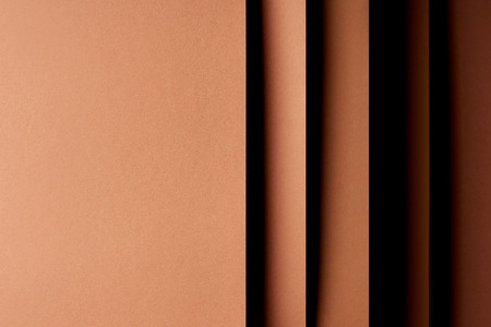 Abstract background with paper sheets in brown tonesの写真素材