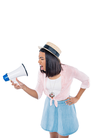 portrait of angry african american woman screaming into loudspeaker isolated on whiteの写真素材