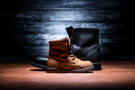 side view of father and son shoes on wooden tabletop, Happy fathers day conceptの写真素材