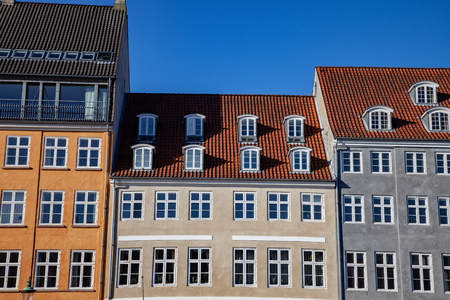 beautiful historical houses against blue sky in copenhagen, denmarkの写真素材