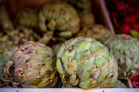 selective focus of artichokes on blurred backgroundの写真素材