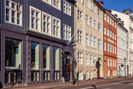 empty street with beautiful colorful buildings in copenhagen, denmarkの写真素材